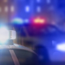 Cop cars with flashing red and blue lights