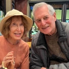 Mark and Marsha leaning into one another in a restaurant.